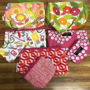 Five sets of makeup bags each with small bag.